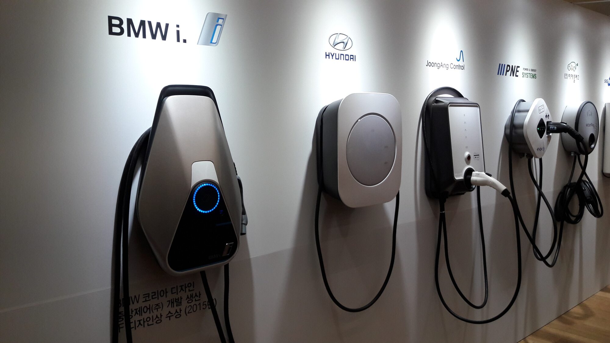 Electrician installing a Level 2 EV charger in a Minnesota home garage